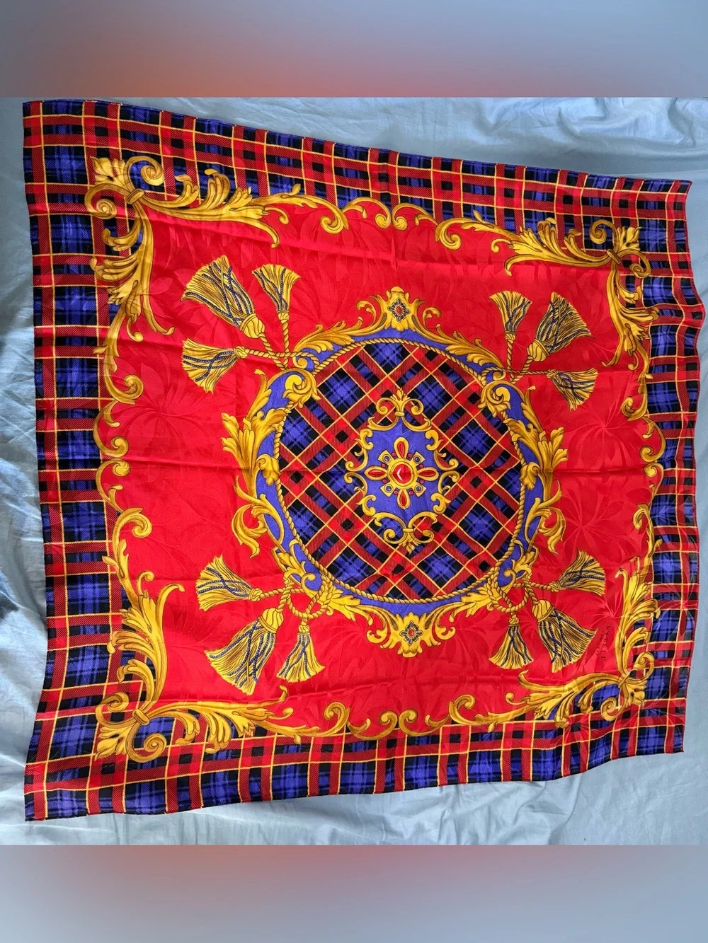 Adrianna Papell tartan background with baroque-style gold chain tassel scarf